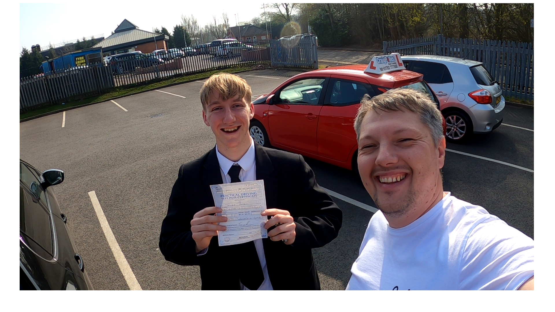 A learner celebrating after passing the driving test